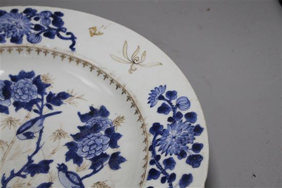 A Chinese grisaille and underglaze blue dish, c.1740, decorated with birds, bamboo, rocks and flowers, label verso from Viscount Bridpo